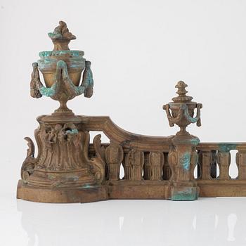 A Louis XVI style bronze grate, 19th Century.