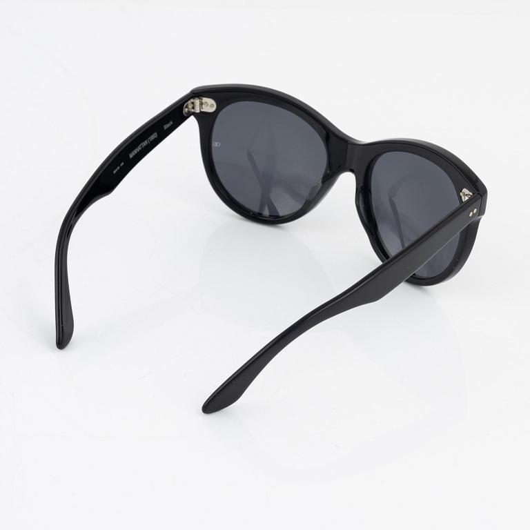 Oliver Goldsmith, a pair of black "Manhattan" sunglasses.
