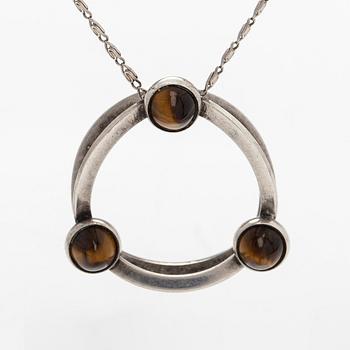 Elis Kauppi, a silver and tiger's eye pendant, Kupittaan Kulta, Turku. With chain in silver.