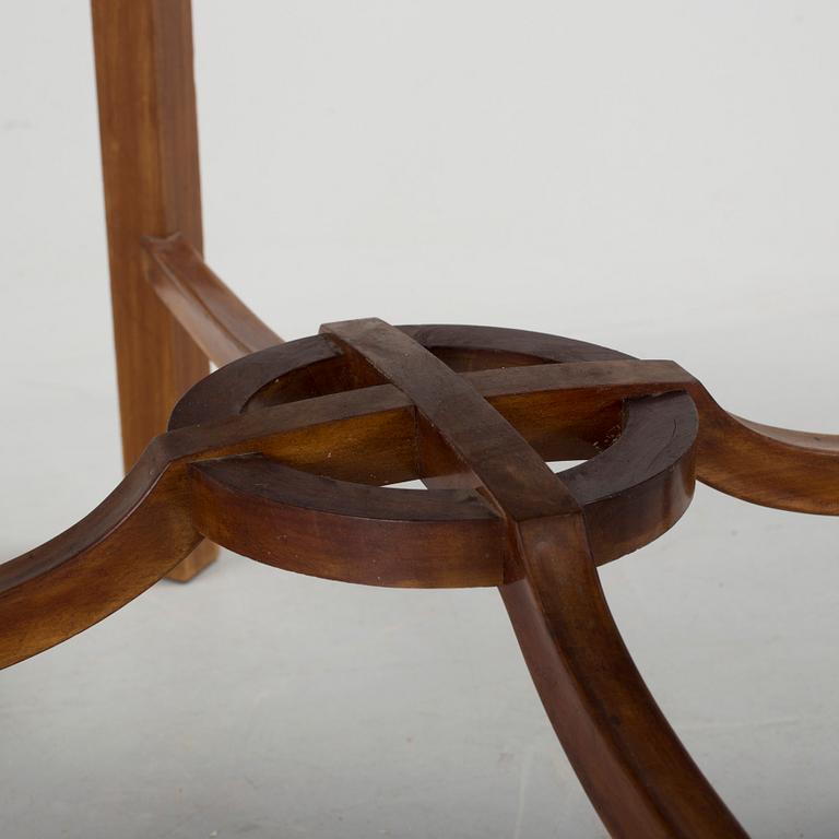 A mid 20th century mahogany veneered table from Nordiska Kompaniet (NK).