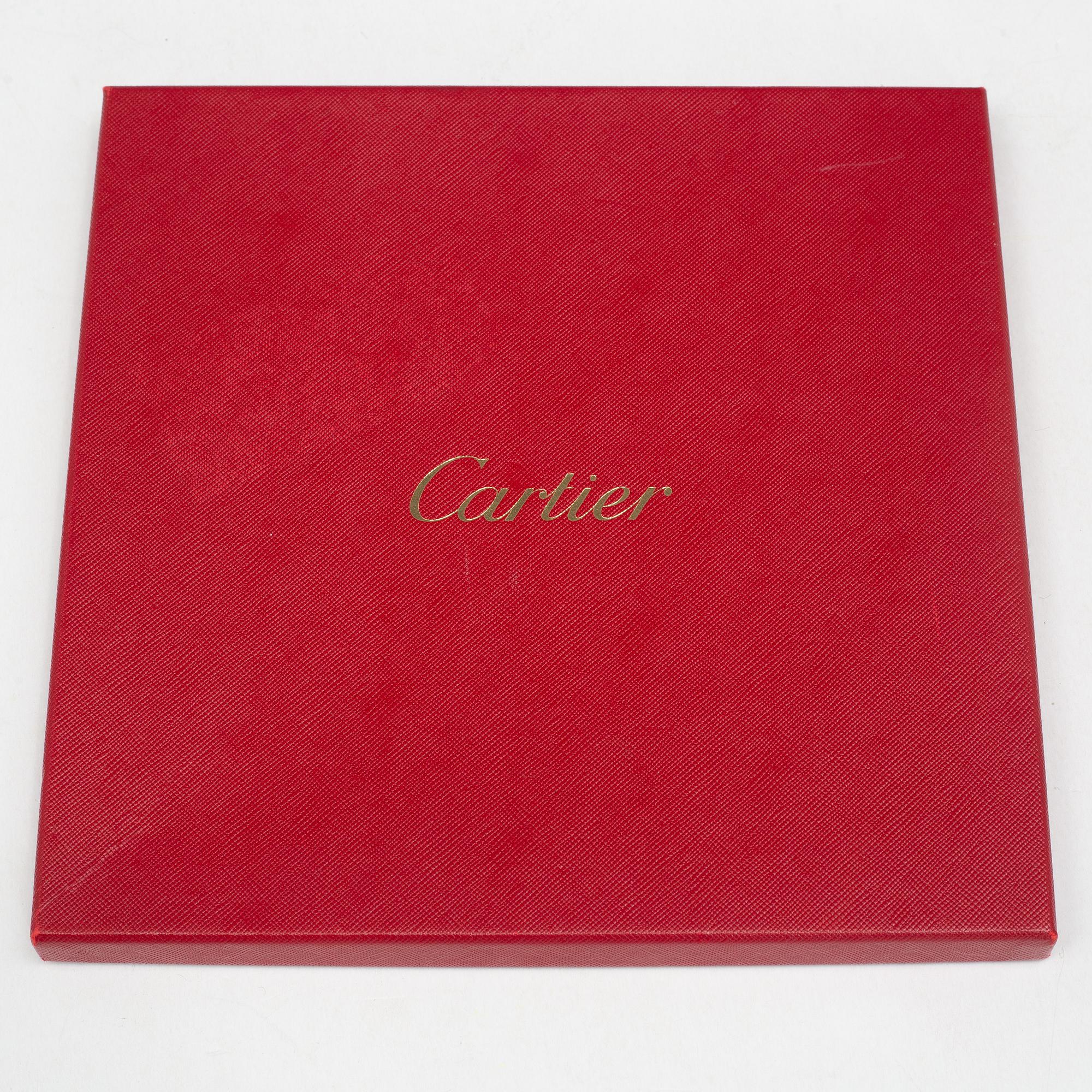 Cartier, a jacquard silk scarf.