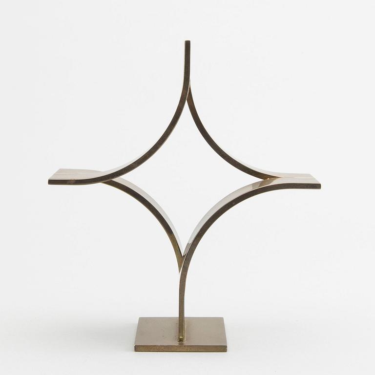 WILLIAM CROVELLO, a signed brass sculpture.