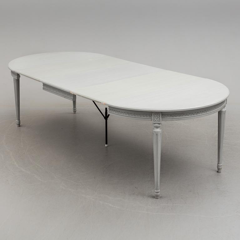 A Gustavian style dining table and ten chairs, 20th century.