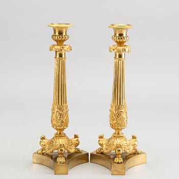 A pare of late empire candelsticks mid 19th century.