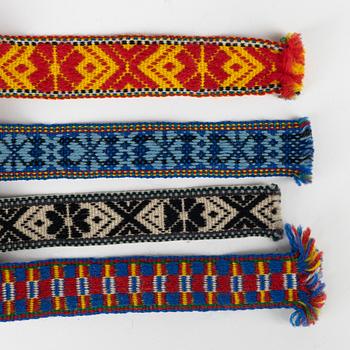 Twelve woven multicoloured bands, 20th Century.