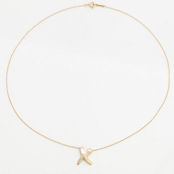 Tiffany & Co, Paloma Picasso, an 18K gold "X Kiss" necklace.