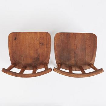 Axel Einar Hjorth, a pair of stained pine 'Utö' chairs, Nordiska Kompaniet, Sweden 1930s.