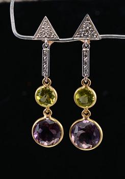 A PAIR OF EARRINGS AND A NECKLACE, amethysts, peridotes and brilliant cut diamonds c. 0.17 ct. Weight 9,5 g.