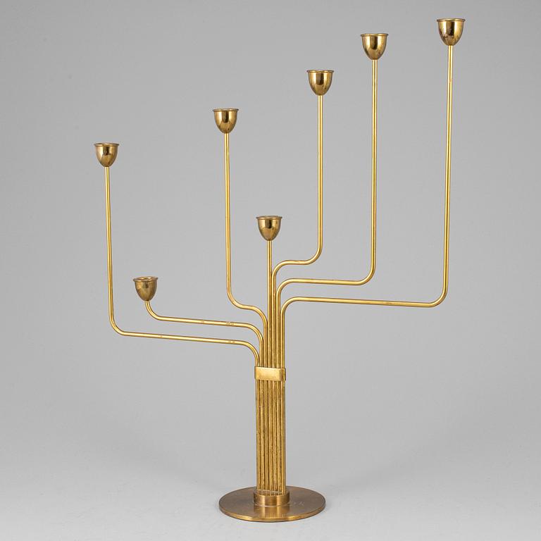 PIET HEIN, an 'Ursa Major' brass candelabrum, Denmark, designed in 1953.