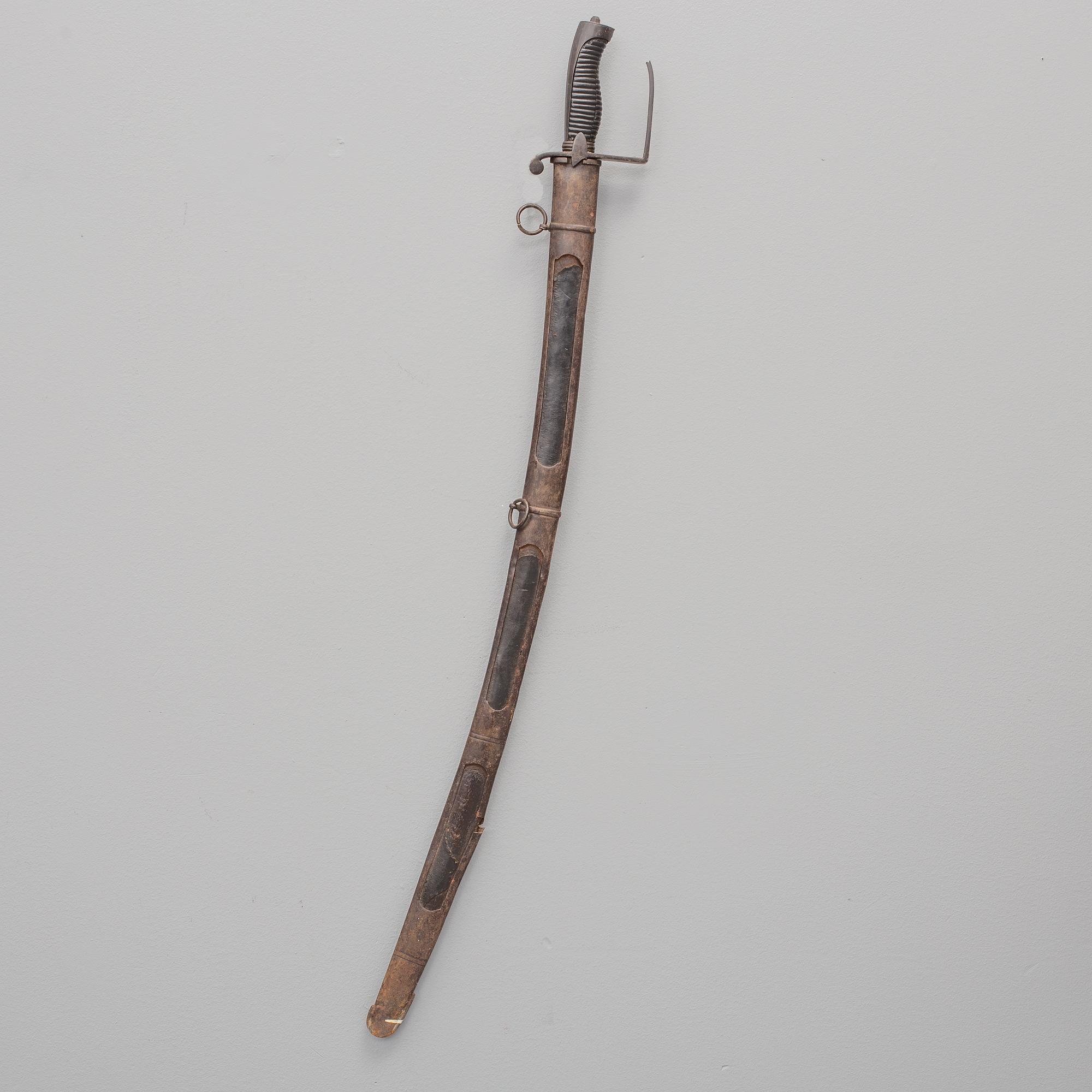 A british sabre with scabbard circa 1800.