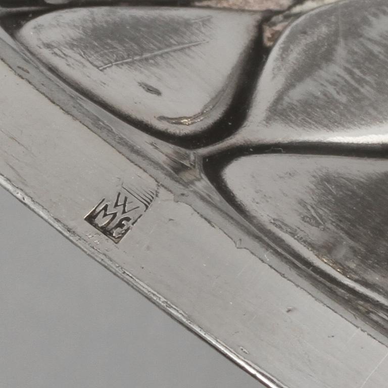 SERVETTHÅLLARE samt LJUSSTAKAR,ett par, metall,Wurtembergische Metallwaren Fabrik (WMF), jugend,1900-talets första hälft.
