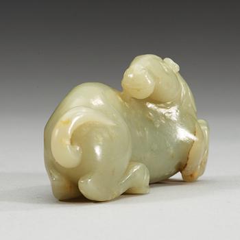 A carved nephrite figure of a reclining horse.