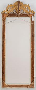 A second half of the 20th Century rococo style mirror with a console table.