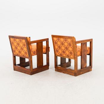 A pair of similar stained wood art déco armchairs from the first half of the 20th century.