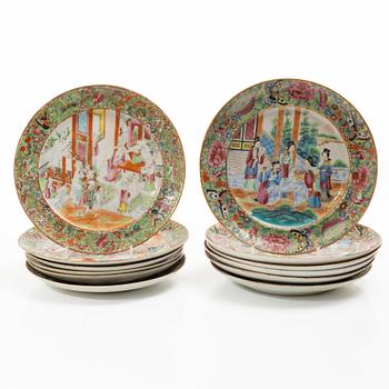 A matched set of 14 famille rose 'Canton' dinner plates, Qing dynasty, 19th century.