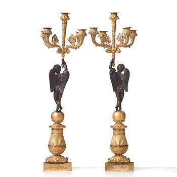 A pair of French Empire early 19th century five-light candlesticks.