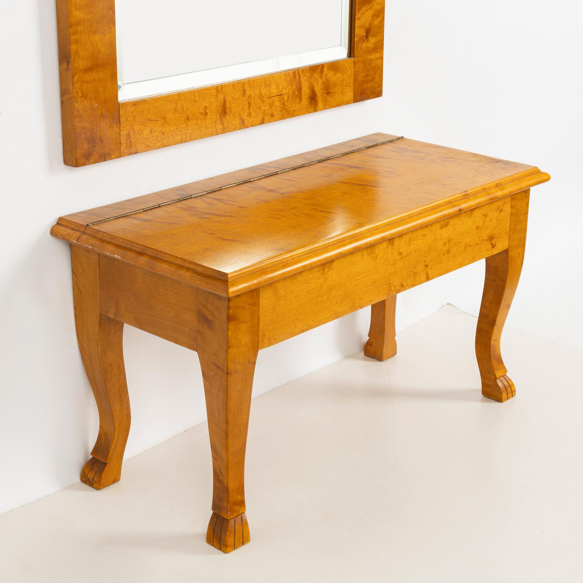 A mirror with console table, early 20th century.