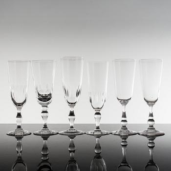 18 glass champagne flutes, ca 1900.