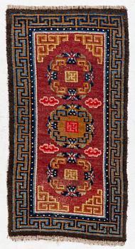 An antique Tibet 'Khaden' rug, c 135 x 70 cm.