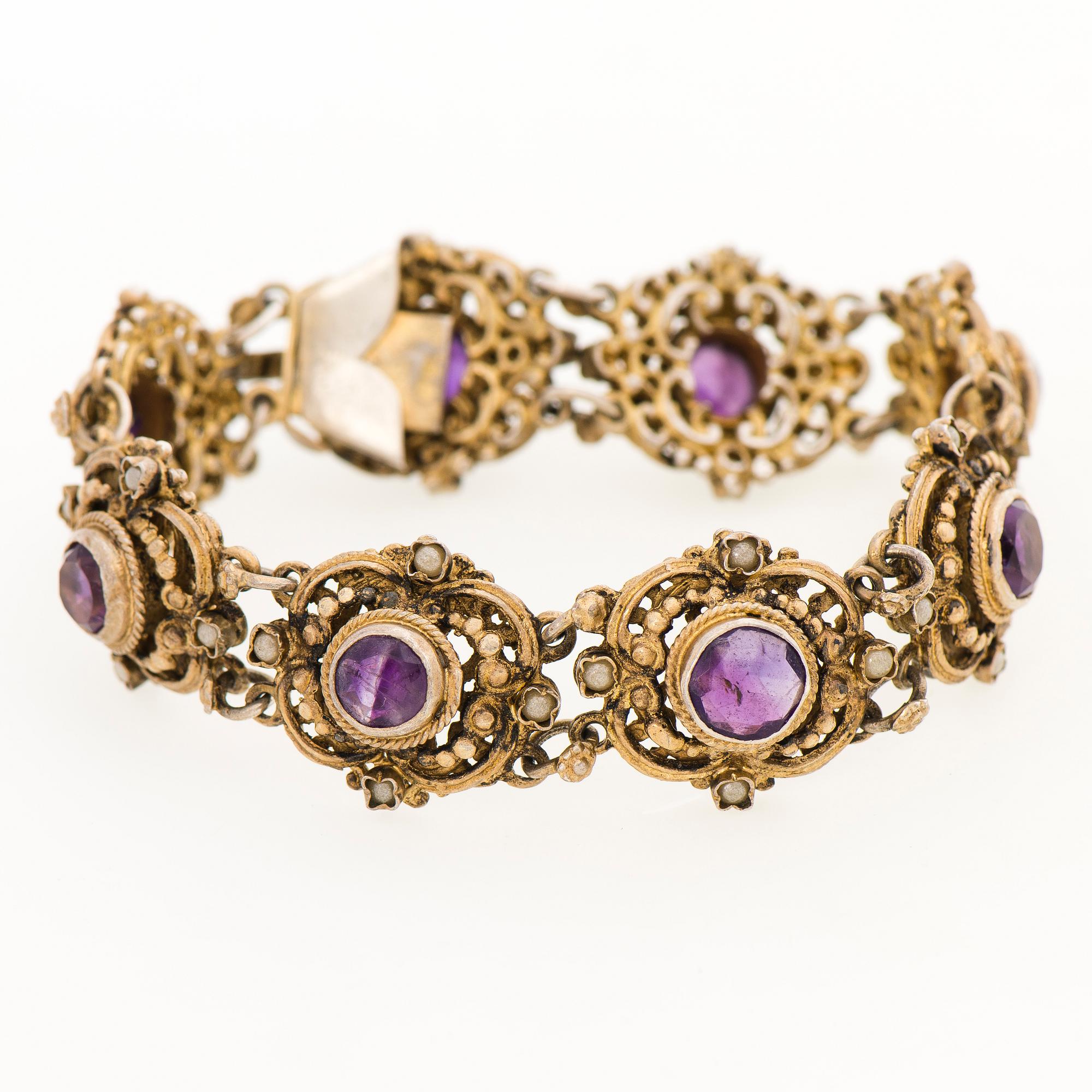 A BRACELET, goldplated silver, amethysts, pearls. Import marks, Kulta-Kontu, Helsinki Finland 1952.
