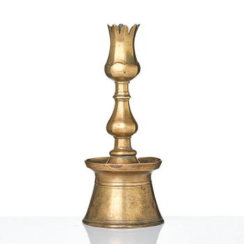 An Ottoman brass 'Tulip' Candelstick, Turkey, 17th/18th century.