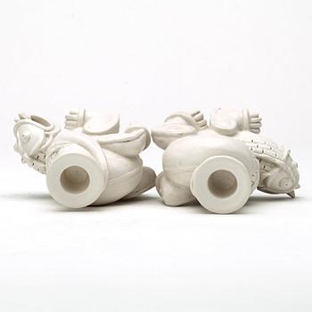 Wilhelm Kåge, a set of stoneware figures of a 'dragon puppy' and two 'dragon puppies' with candle holders, Gustavsberg, ca 1940.