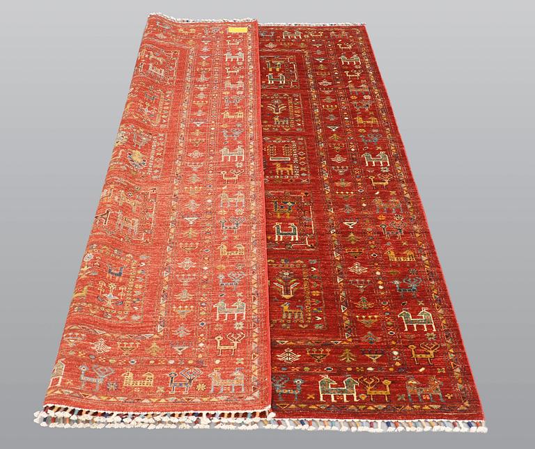 A rug, Ziegler design figural, ca 235 x 168 cm.