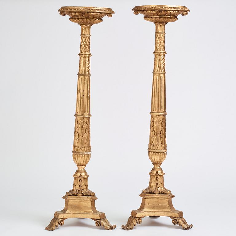 A pair of Swedish Empire giltwood gueridons, Stockholm, first part of the 19th century.