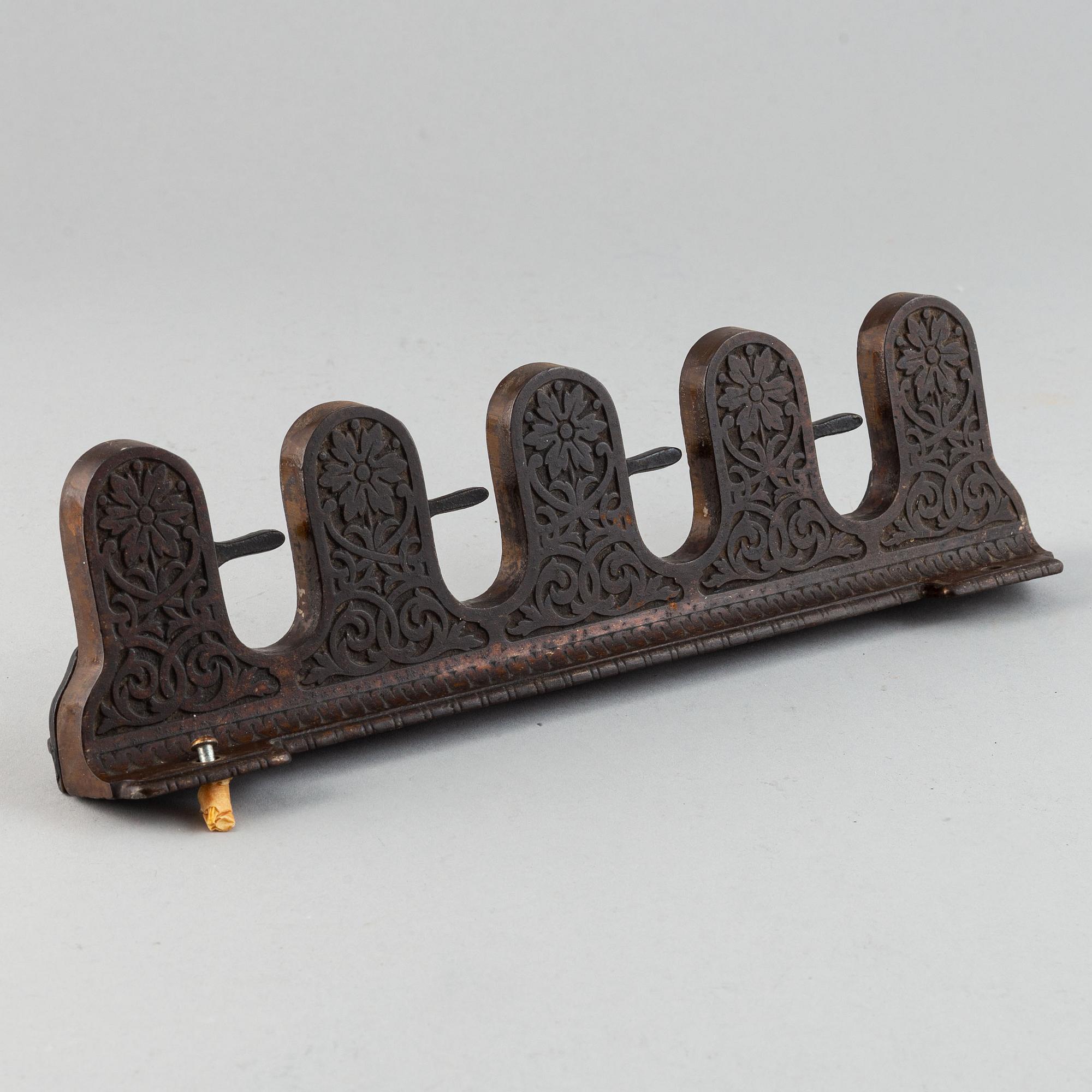 A 19th century iron umbrella and walkingstick holder.