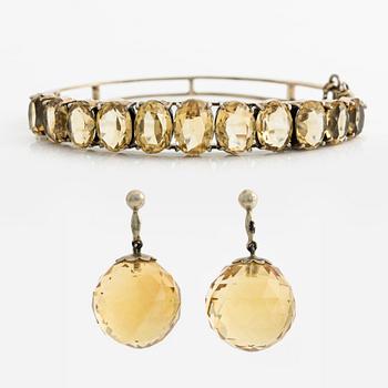 A bracelet and a pair of earrings.