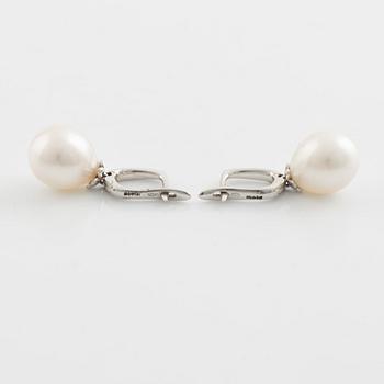 Freshwater pearl and brilliant cut diamond earrings.