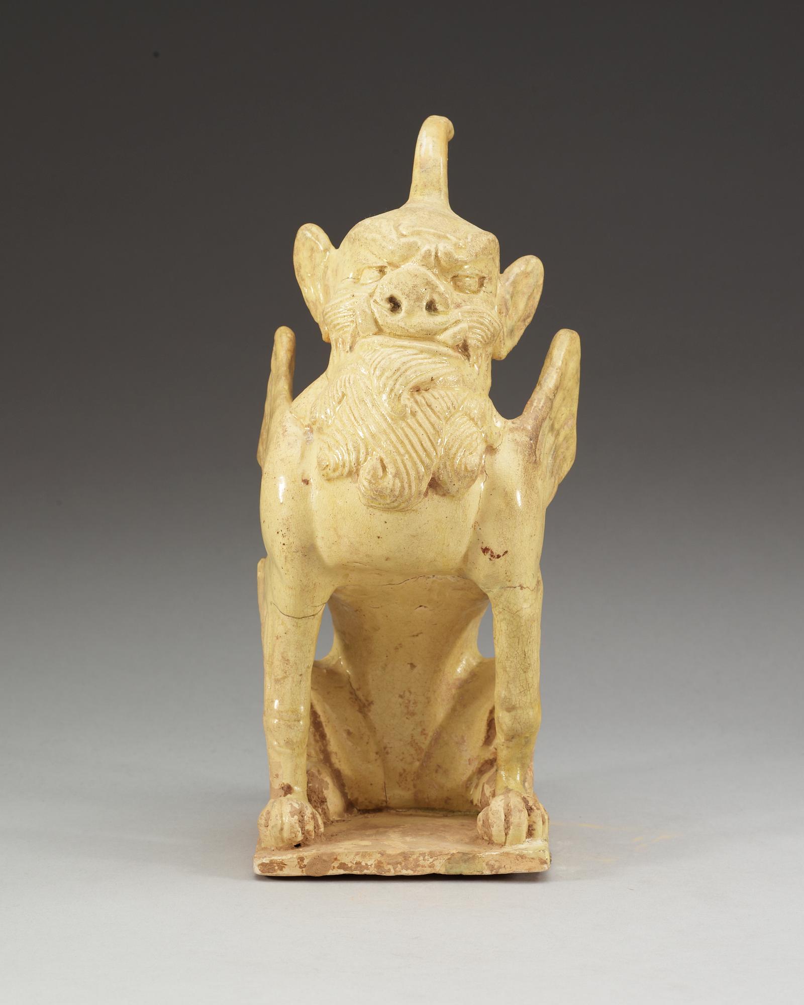 A yellow glazed pottery guardian, Tang dynasty (618-907).