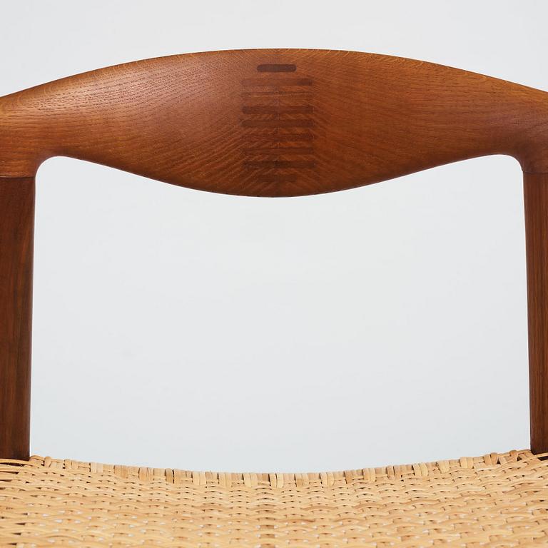 Hans J. Wegner, a teak, oak and cane "Cowhorn chair", JH 505, Johannes Hansen, Denmark 1950-60's.