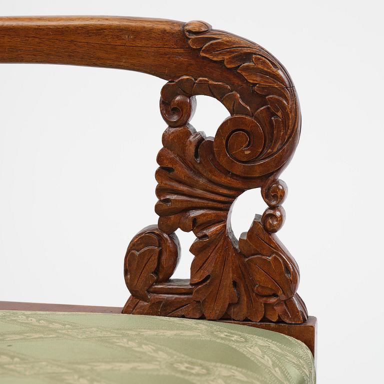 A pair of Baltic / Russian mahogany Empire armchairs, first part 19th century.