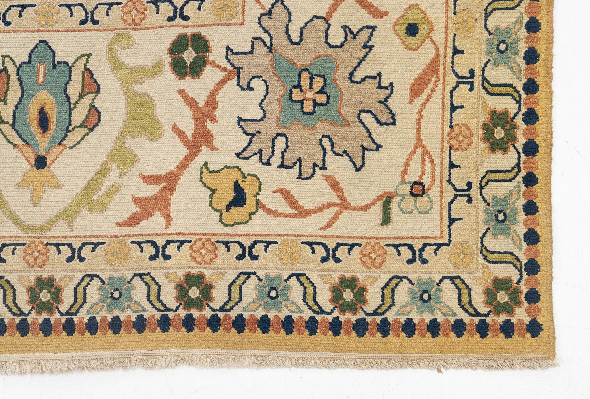 An Indian flat weave carpet of 'Shah Abbas' design, c. 402 x 289 cm.