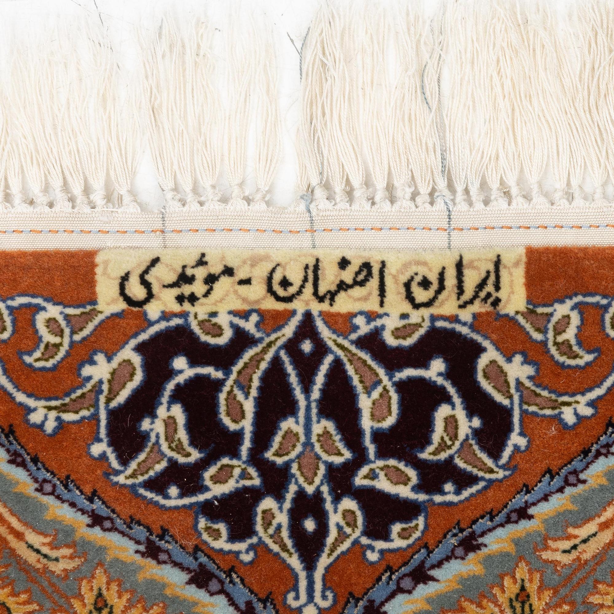 A part silk Isfahan rug, Central Persia (Iran), signed 163 x 108 cm.
