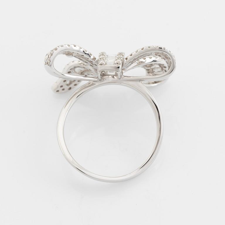 Baguette- and brilliant cut diamond bow ring.