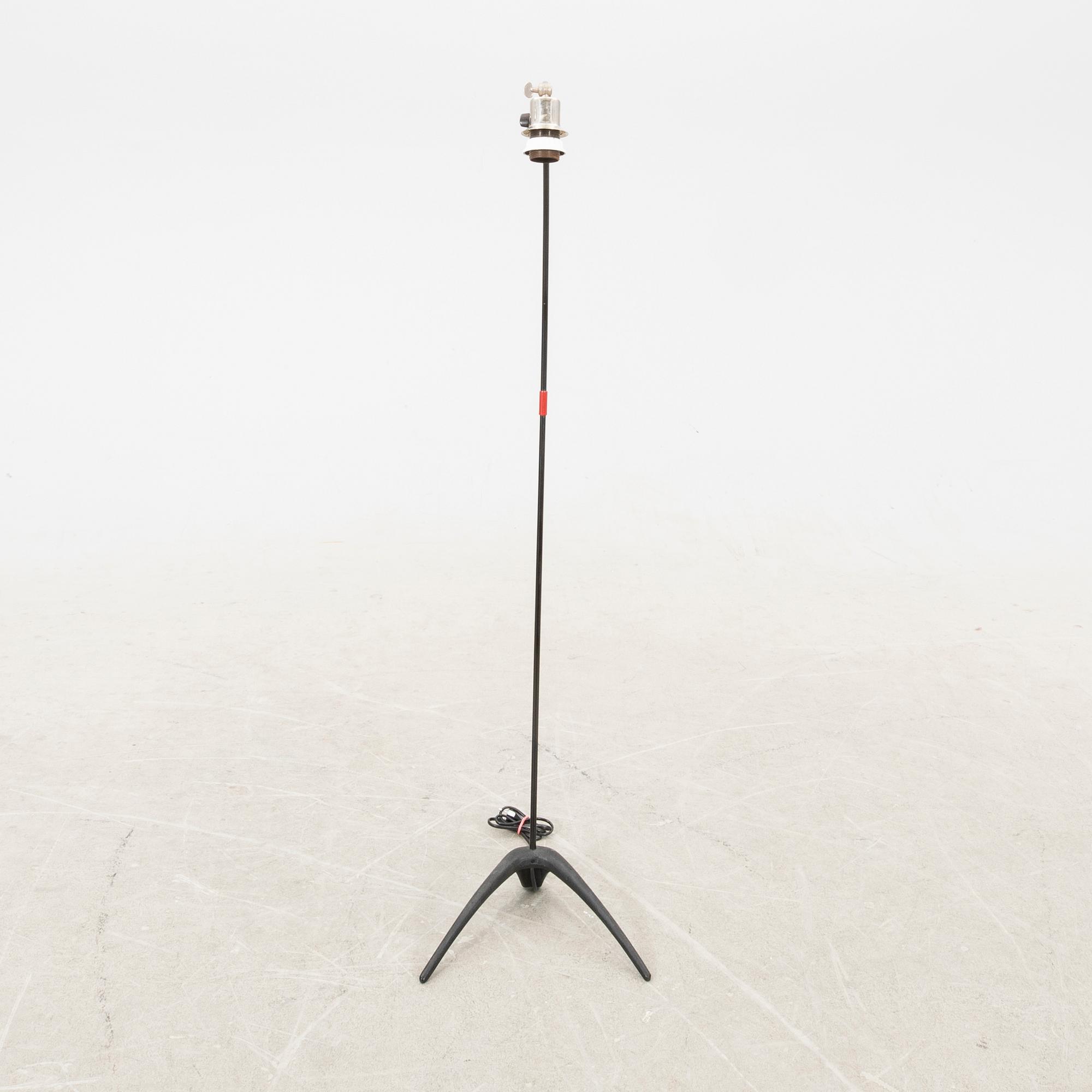 A metal floor lamp from the later part of the 20th century.