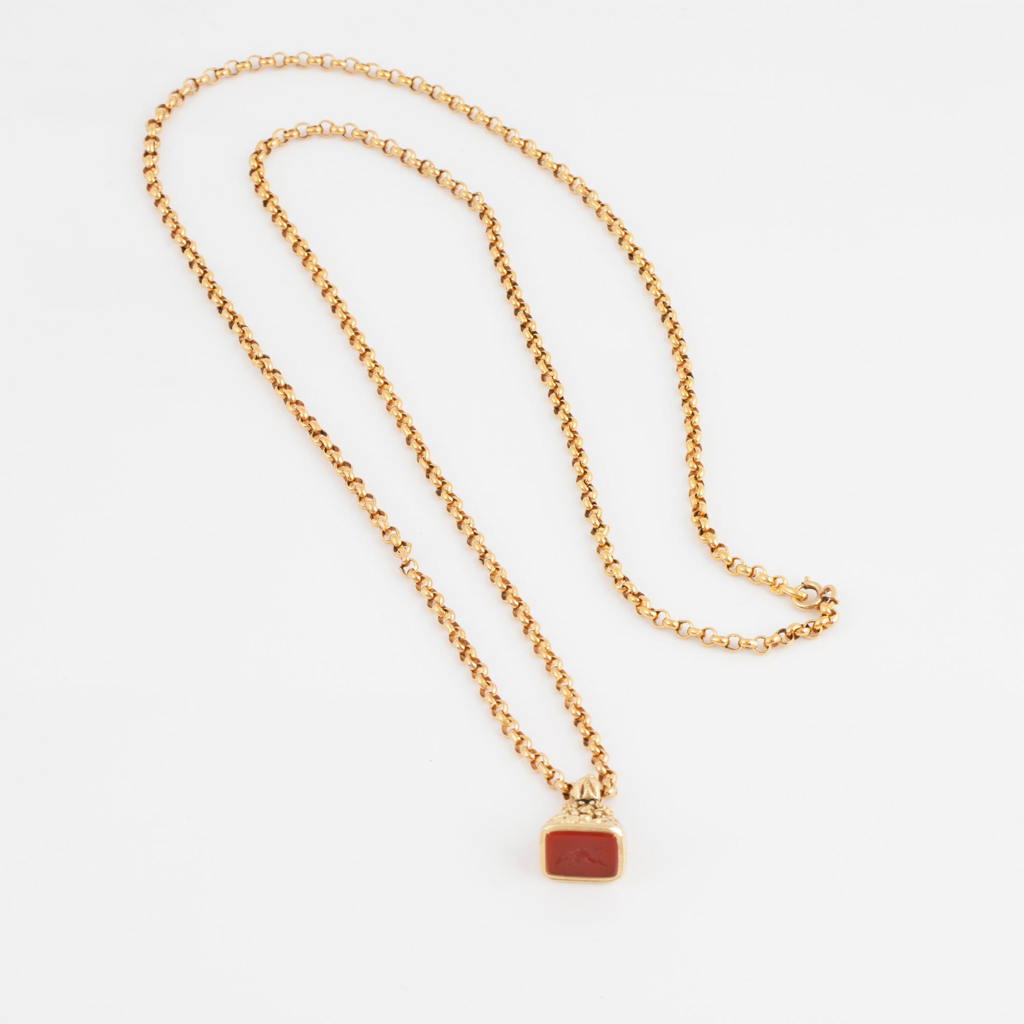 A carnelian seal in a chain.