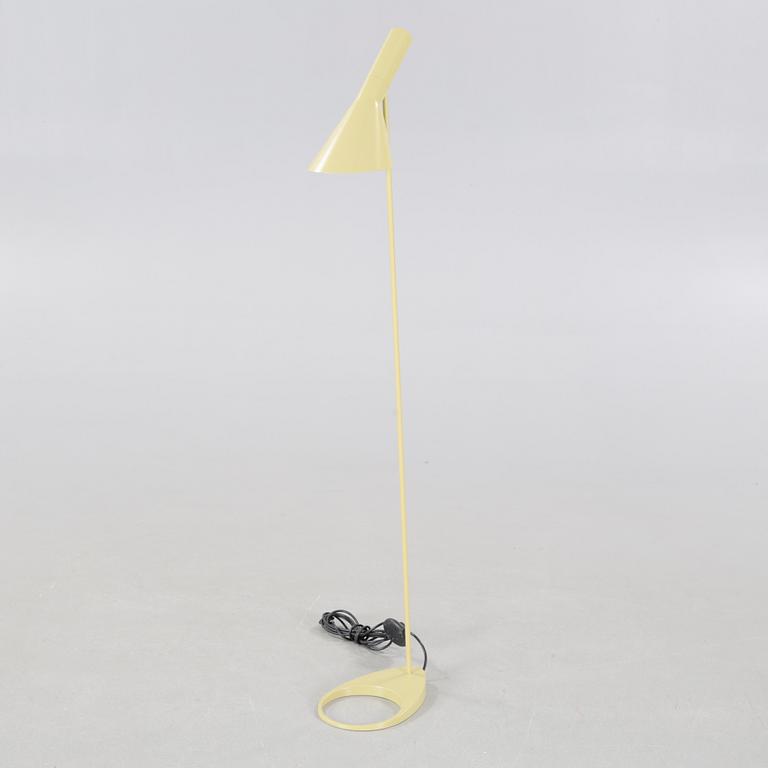 An "AJ" floor lamp, designed by Arne Jacobsen for Louis Poulsen, 21st century.