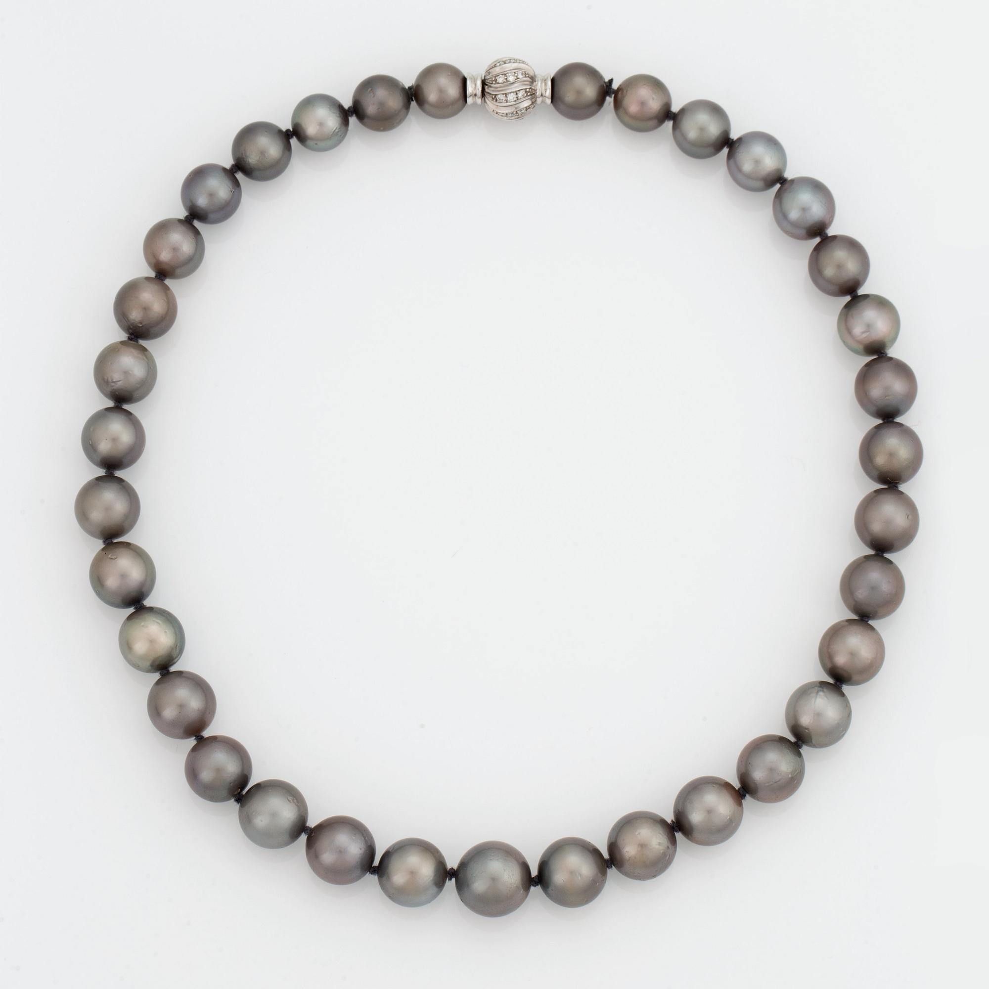 A NECKLACE of cultured Tahiti pearls.