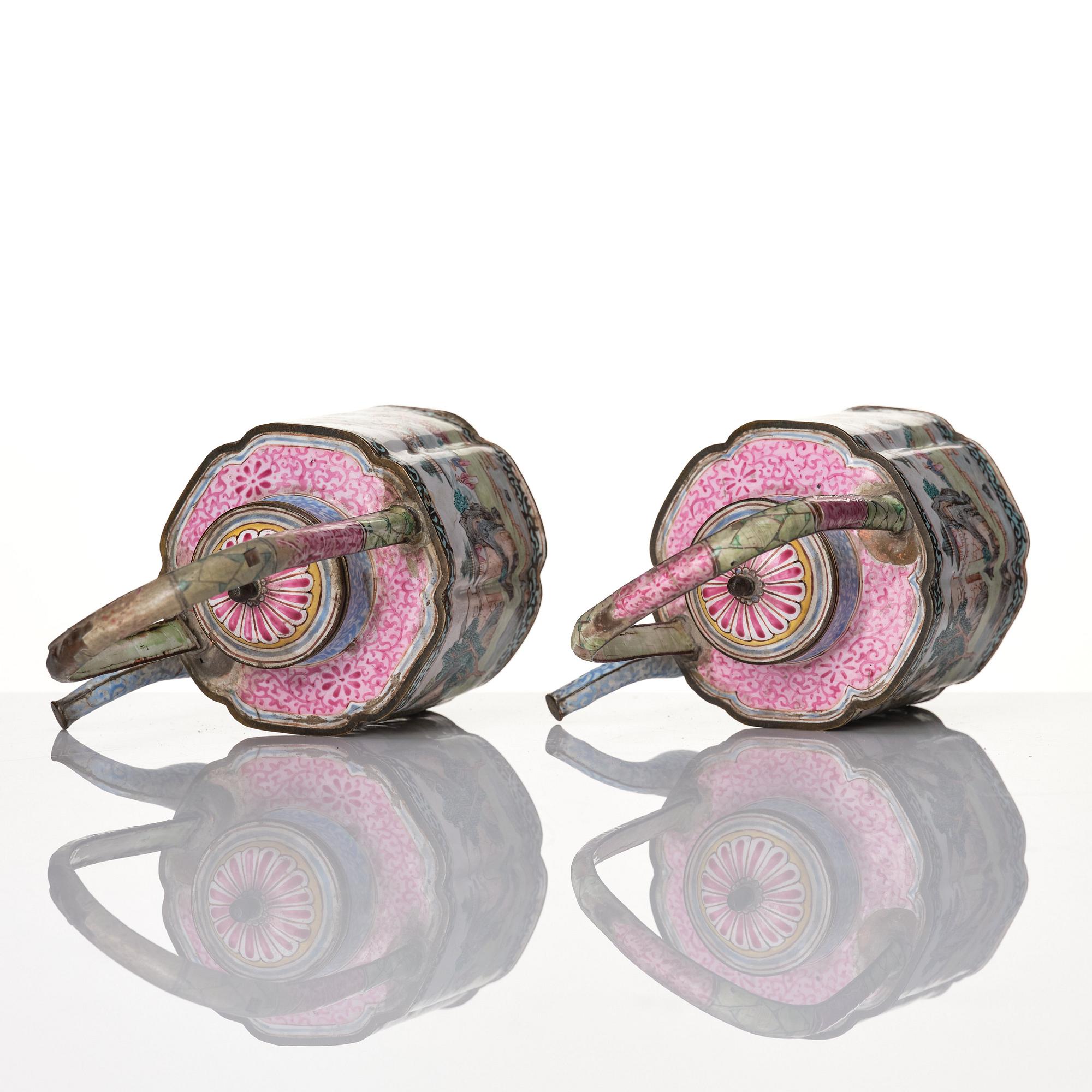 A Chinese pair of enamel on copper tea pots, Qing dynasty, Qianlong (1736-95).