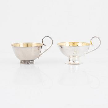 A set of twelve Swedish silver punsch mugs, including Stockholm 1965.