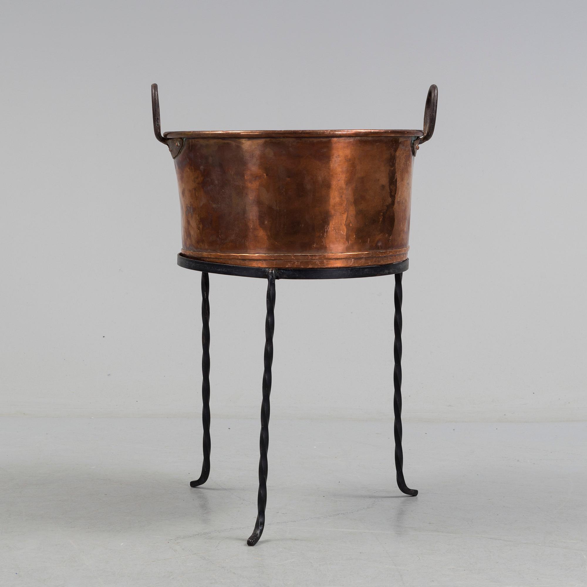 A 19th century copper cauldron.