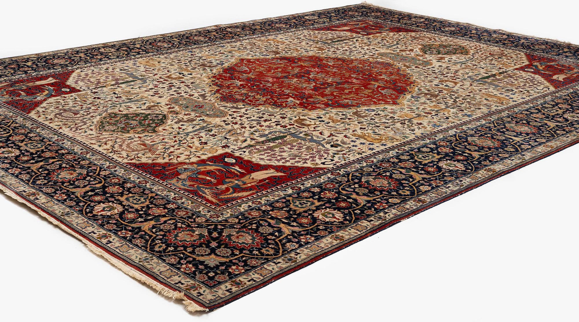 A semi-antique Benlian Tabriz carpet of 'Coronation' design, signed Jabarzade, c. 488 x 367 cm.