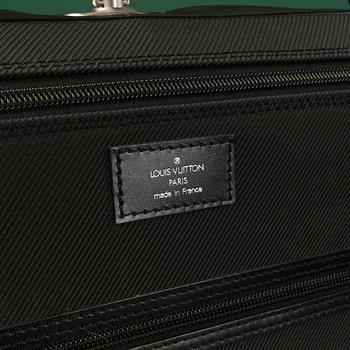 A Garment bag by Louis Vuitton.