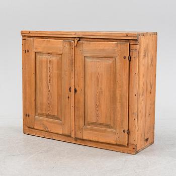 A 19th Century pine cabinet.