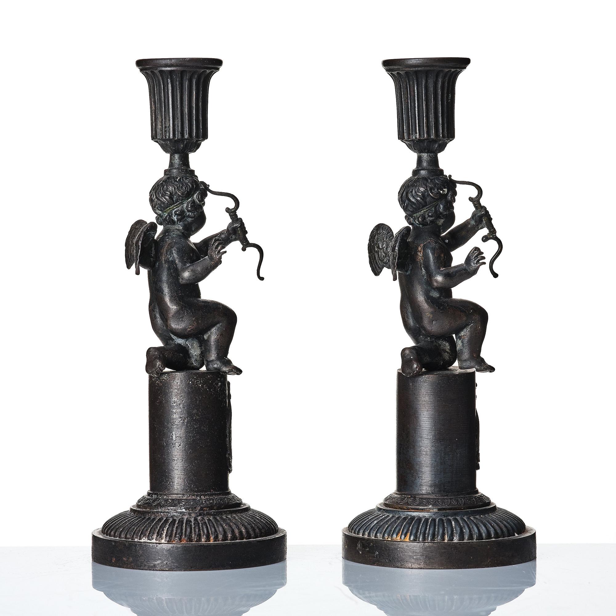A pair of German (Berliner Eisen) Empire iron candle sticks.