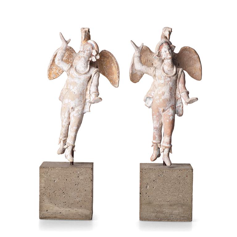 A pair of greek pottery figures of Zeus and Ganymede, Hellenistick period, circa 2nd Century B.C.