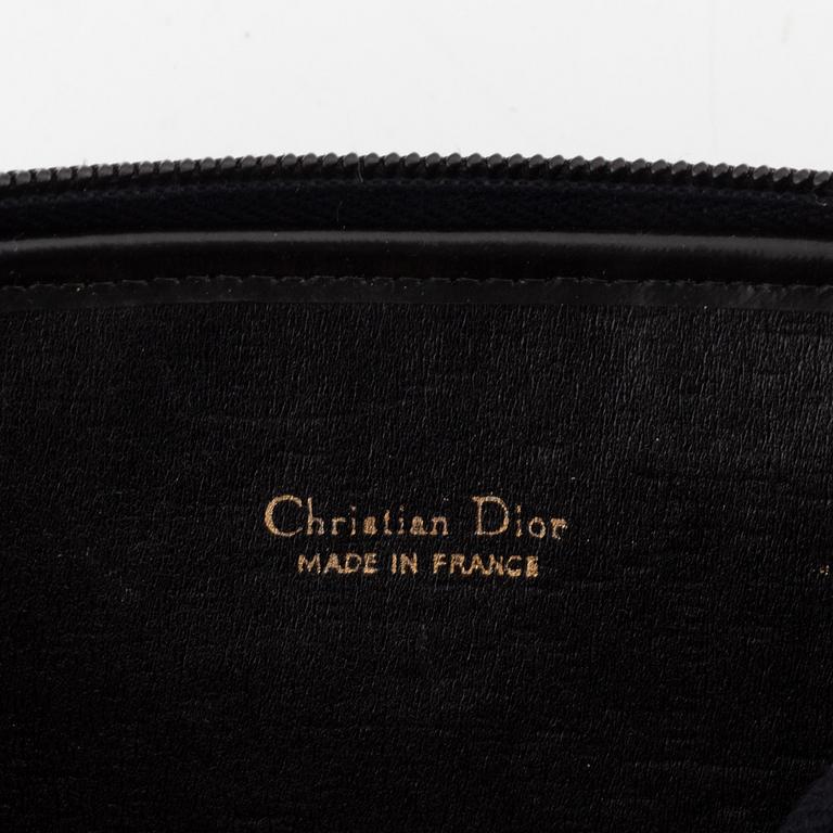 Christian Dior, a black canvas umbrella, toilet bag, coin purse and wallet.